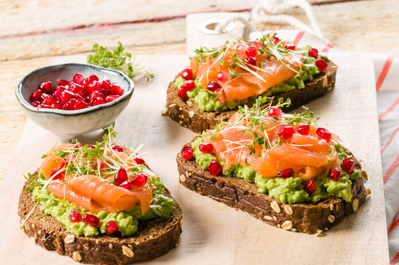 Avocado toast with salmon and pomegranate